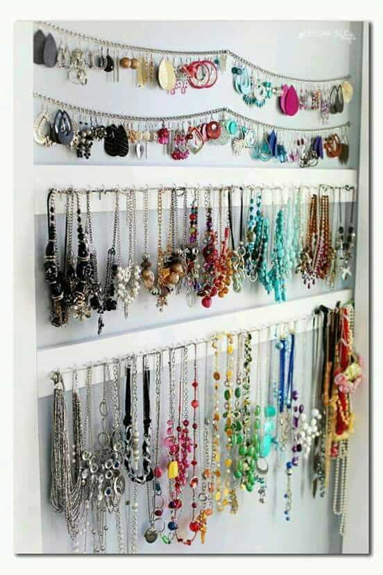 Jewelry hanging on walls with hooks