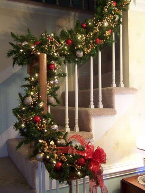 red and white christmas staircase with garland