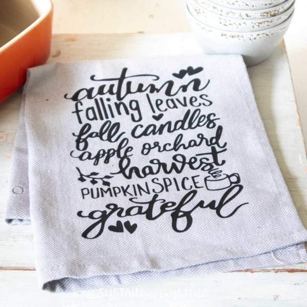 Cricut svg design printed on tea towel, all fall words