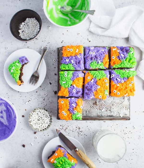 Colorful Fancy Monster Brownies in purple, green and orange with googly eyes