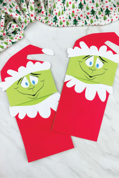 2 paper bag grinch looking crafts
