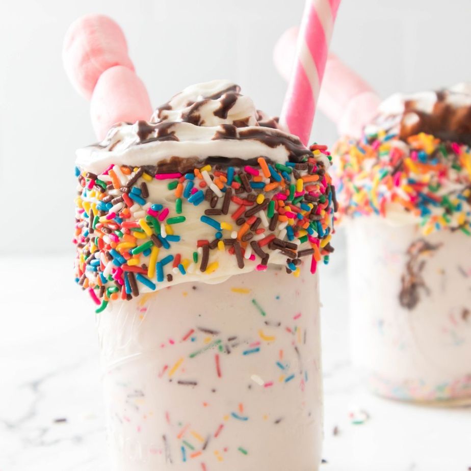 Vanilla Bean Funfetti Milkshake in Mason Jar with straw and marshmallows
