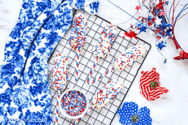Patriotic Chocolate Covered Twinkies on a baking tray with red white and blue decorations