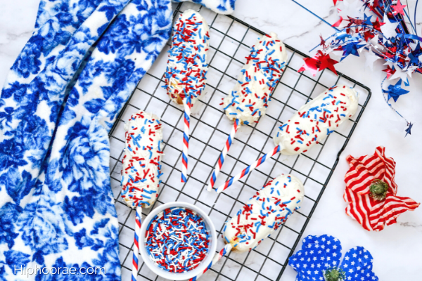Patriotic Chocolate Covered Twinkies on a baking tray with red white and blue decorations