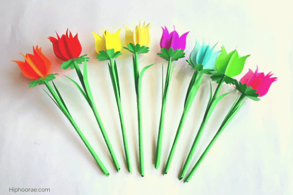 8 paper tulip flowers in a row