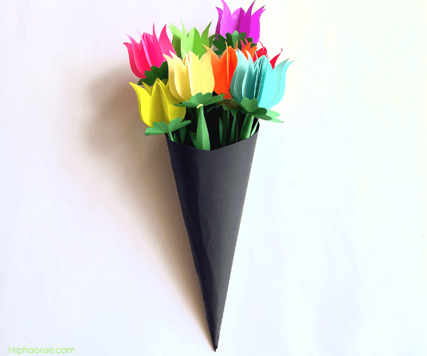 Arrange paper tulips in cardstock cone