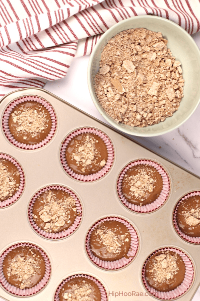 sprinkle cupcakes before baking with crushed Kit Kats