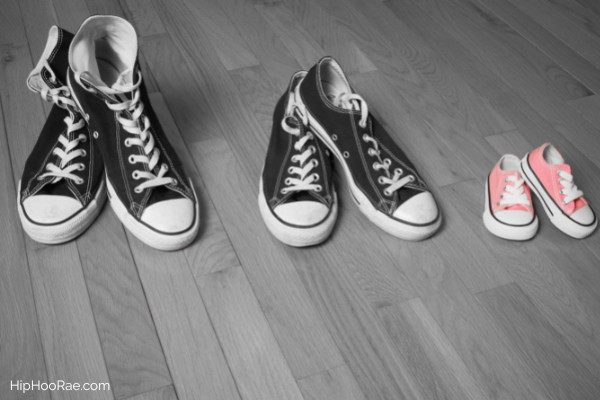 3 pairs of shoes black and white and baby ones in pink