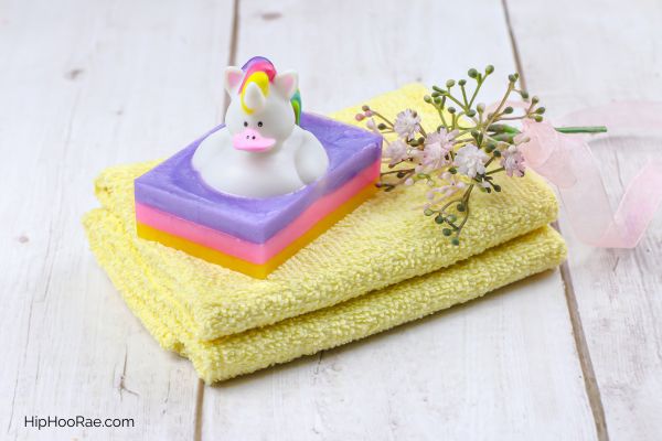 DIY Unicorn Rubber Duck Soap on yellow facecloth