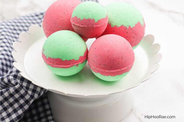 White plate with 5 watermelon scented bath bombs on display