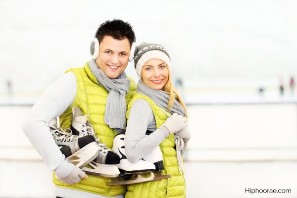Couple in ice skating attire
