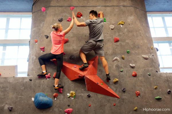Couple indoor rock climbing