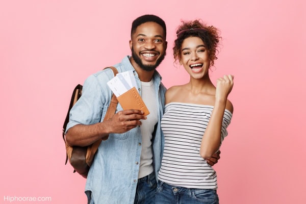 Man holding sports tickets with girlfriend