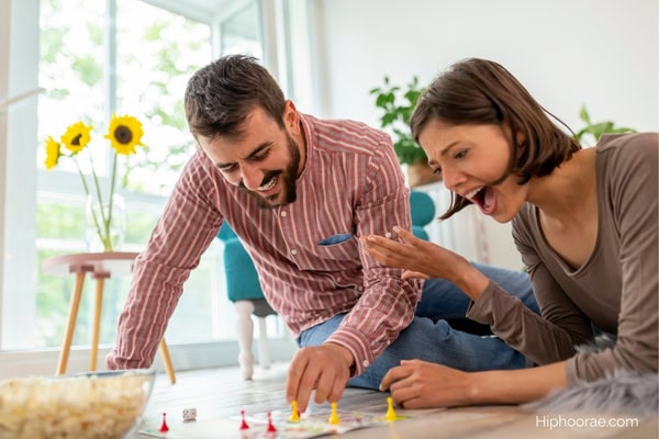 couple playing a board game at home