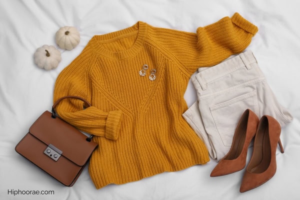 fall outfit laid out on bed