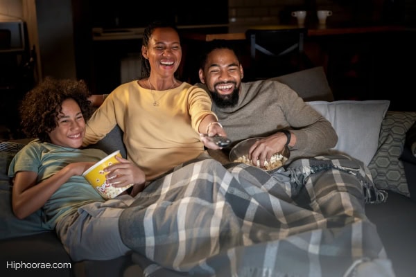 family of 3 watching a movie