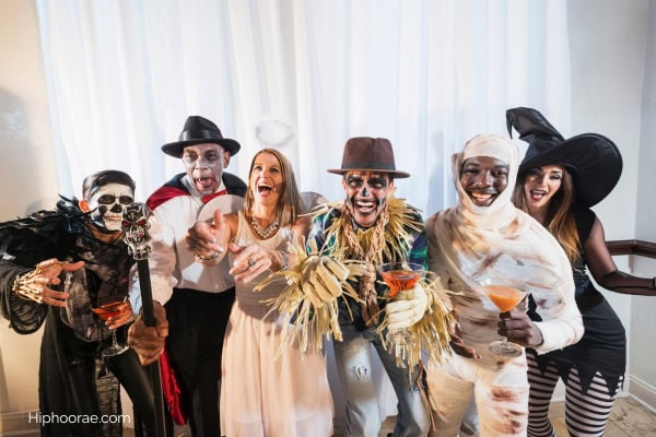 group of friends in Halloween costumes