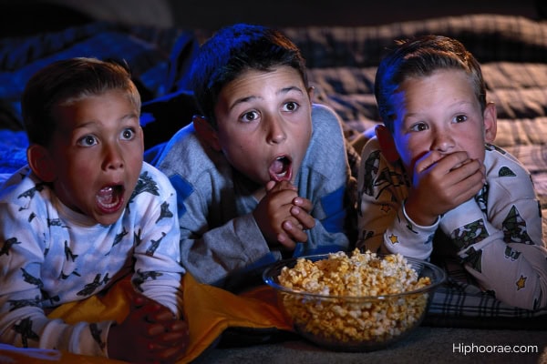 boys watching a scary movie