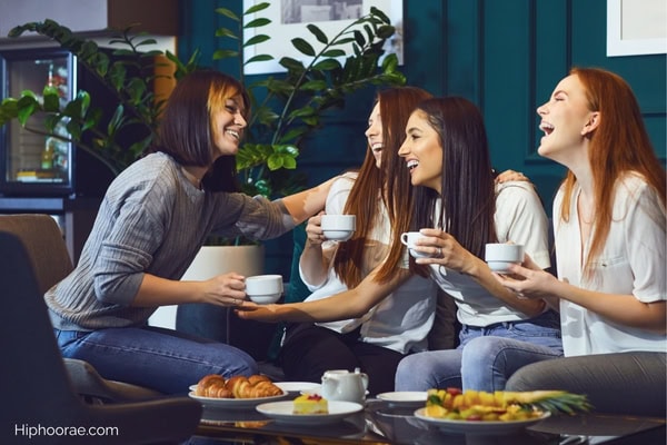 friends laughing at a cafe
