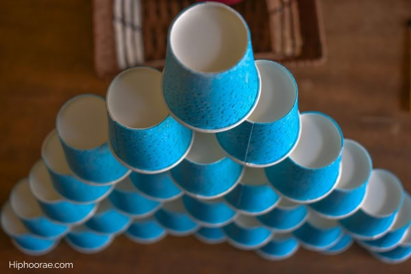 tall pyramid stack of paper cups