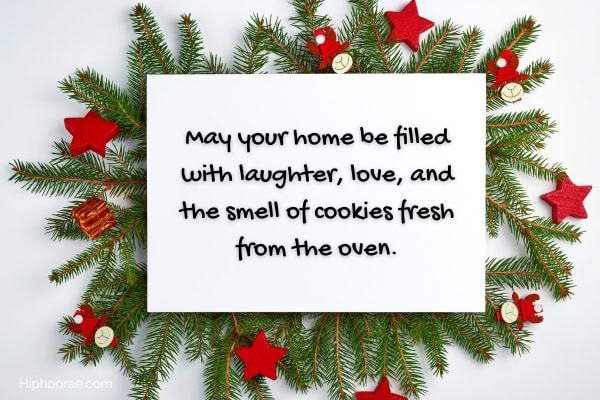 Christmas branches with white card on top with Christmas message overlay