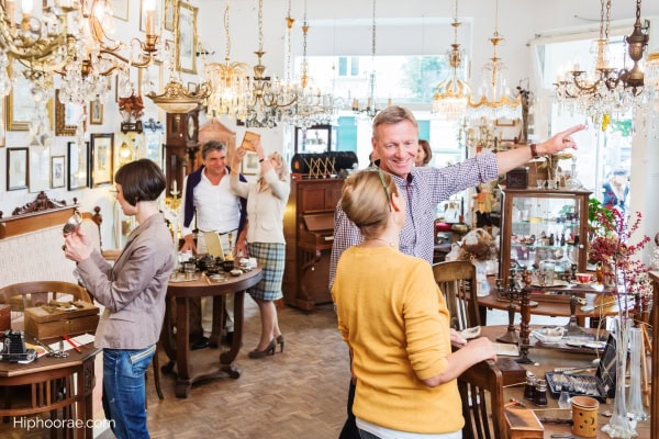 couple and some other people inside antique shop
