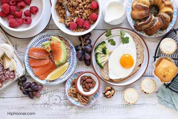 spread of various brunch food on wooden table