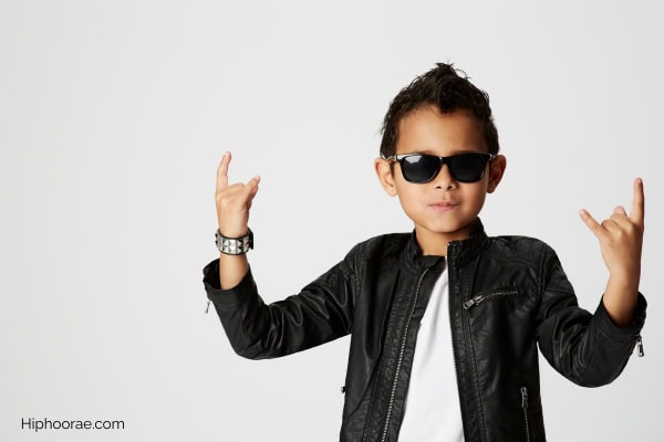 boy wearing leather jacket and dark sunglasses