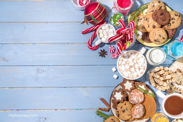 hot cocoa bar with candy canes, cookies, marshmallows, etc