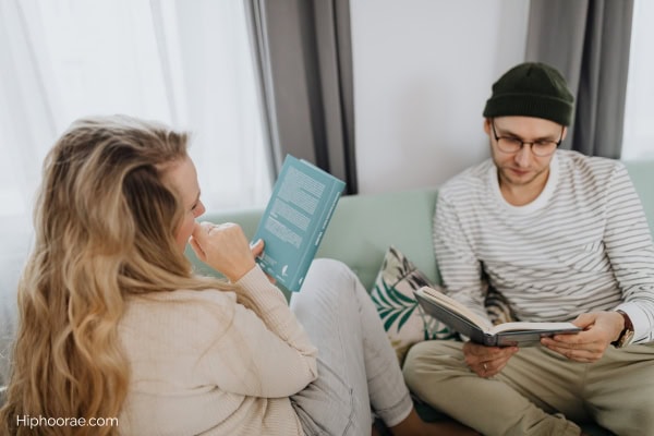 couple reading at home on the couch