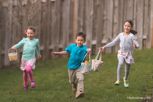 Children running during Easter egg hunt game