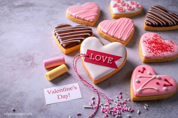 Heart shaped cookies with various frosting decorations