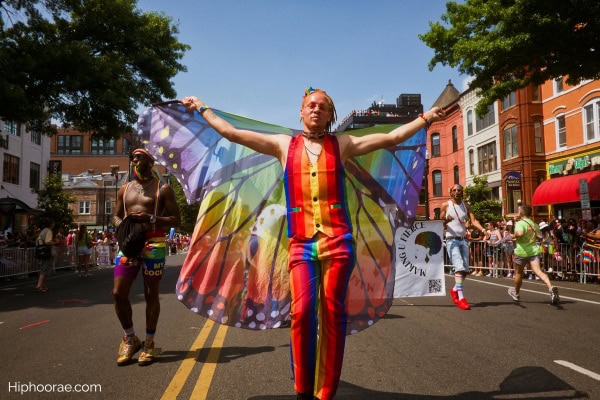 Man wearing colorful clothes at pride month parade