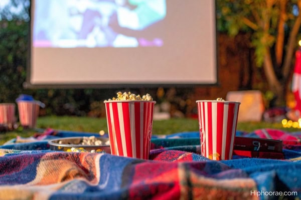 outdoor movie night with blankets and popcorns