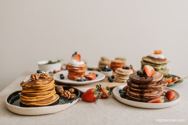 Stacks of pancakes with various toppings