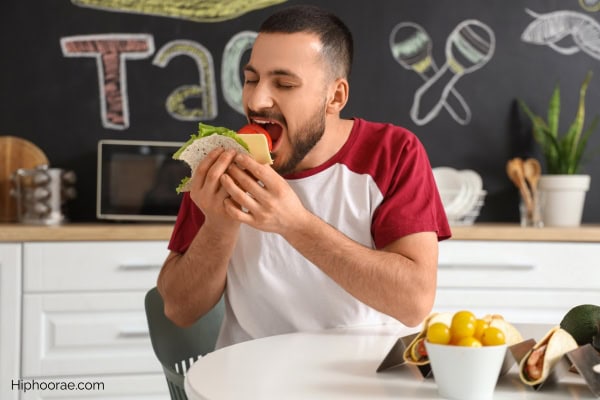 Man eating tacos
