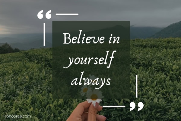 hand holding a flower on field background, with quote overlay