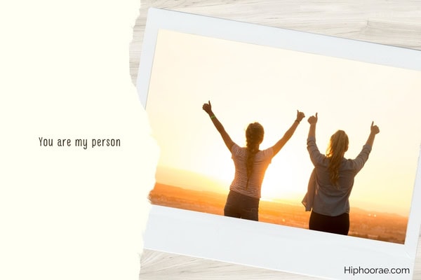 polaroid photo of 2 friends facing the sunset, with quote overlay