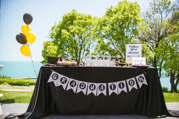 outdoor table setup for a graduation party