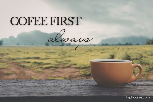 cup of coffee on a ledge overlooking green field, with quote overlay