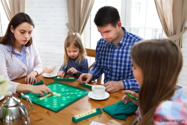 family playing scrabble