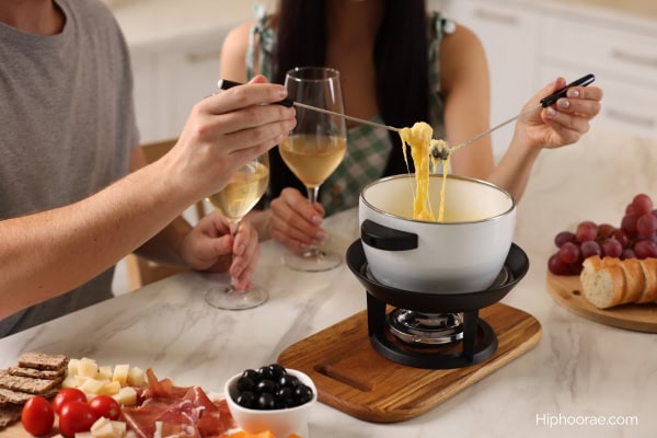 couple having cheese fondue date night