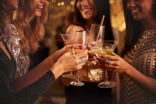 glamorous women drinking at a party