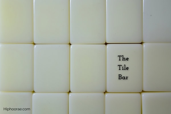 background of upside down mahjong tiles in neat rows, with party name overlay
