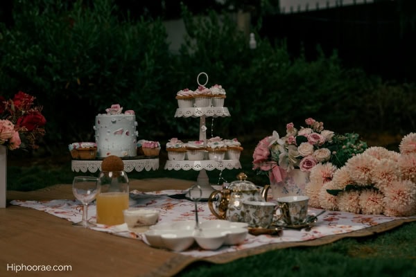 outdoor garden tea party setup with floral decor