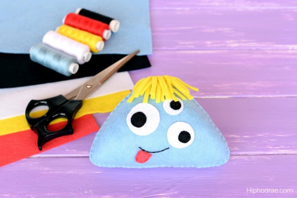 felt monster craft, scissors, various threads